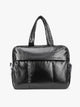 Black CALPAK Luka Large Duffel in vegan leather with dual top handles, shown against a plain white background; DLL2201-BLACK-PU