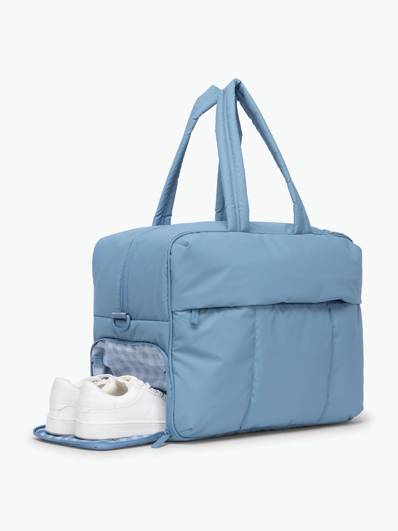 Shoe Compartment of CALPAK Luka Large Duffel in light blue French Blue with white and blue gingham print