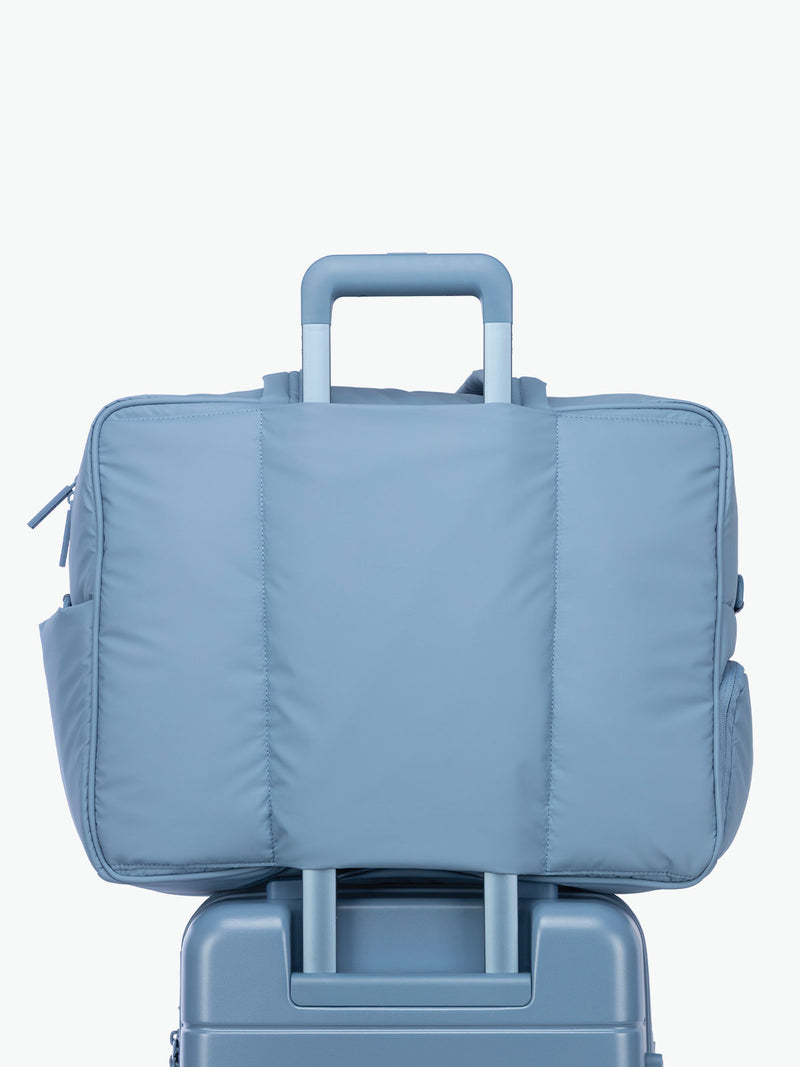 Luggage trolley sleeve of CALPAK Luka Large Duffel in light blue French Blue