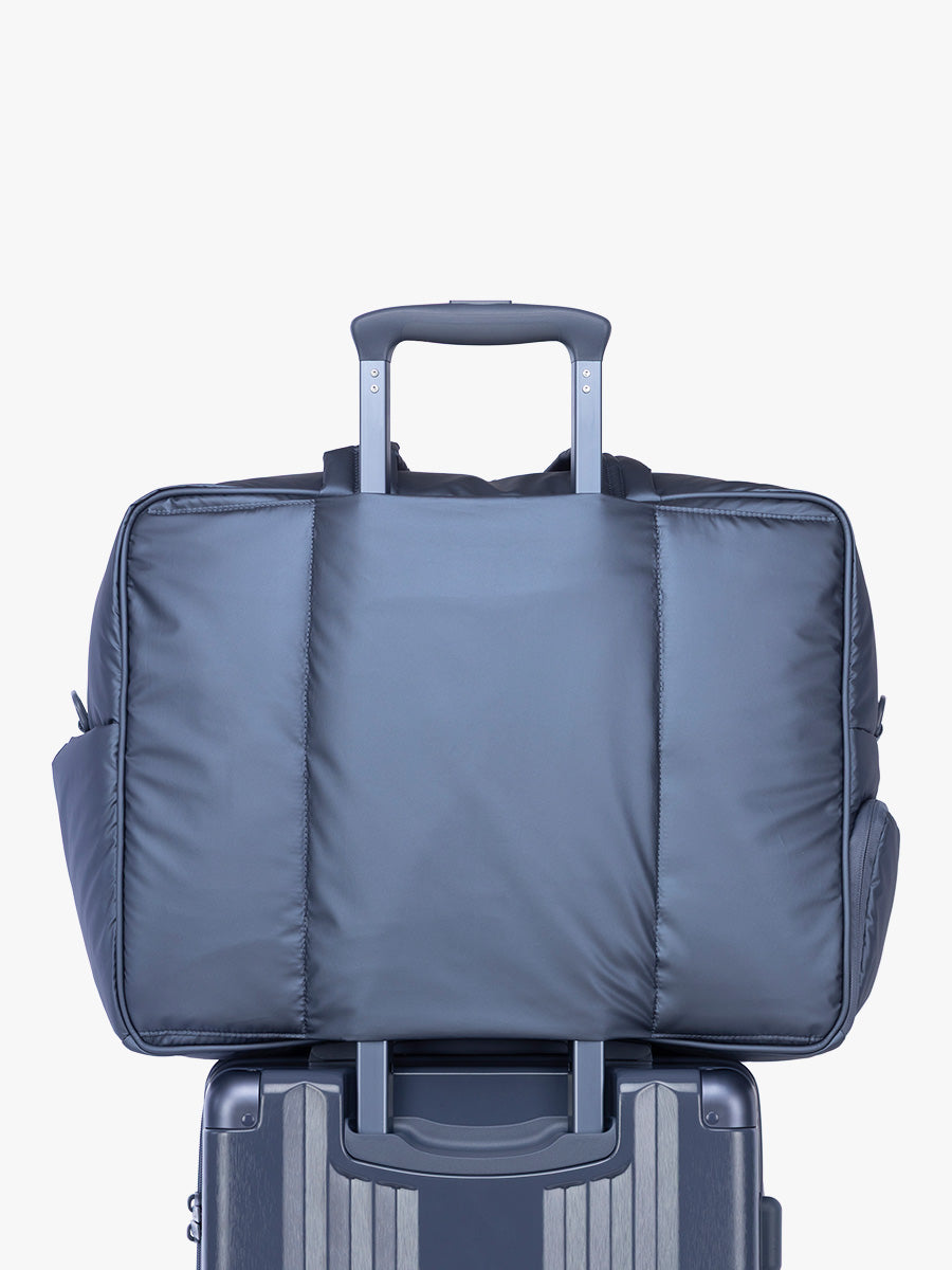 Luggage trolley sleeve of CALPAK Luka Large Duffel in dark blue metallic material in Metallic Indigo; DLL2201-METALLIC-INDIGO
