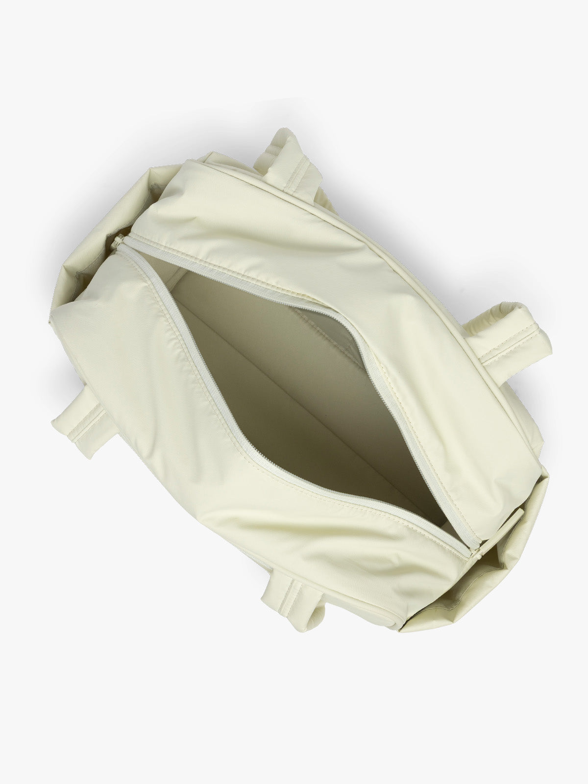 Opened CALPAK Luka Mini Duffel in light green Celadon; DLM2501-CELADON