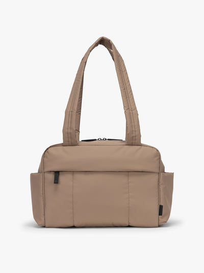 CALPAK Mini Duffel in brown Chocolate front view with puffy exterior, interior and exterior pockets, and padded shoulder straps; DLM2501-CHOCOLATE view 1