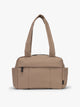 CALPAK Mini Duffel in brown Chocolate front view with puffy exterior, interior and exterior pockets, and padded shoulder straps; DLM2501-CHOCOLATE