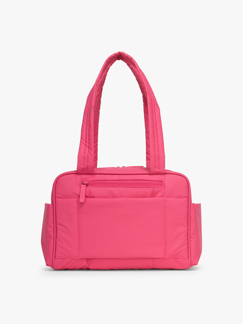 Back side of CALPAK Luka Mini Duffel in bright pink on a white background