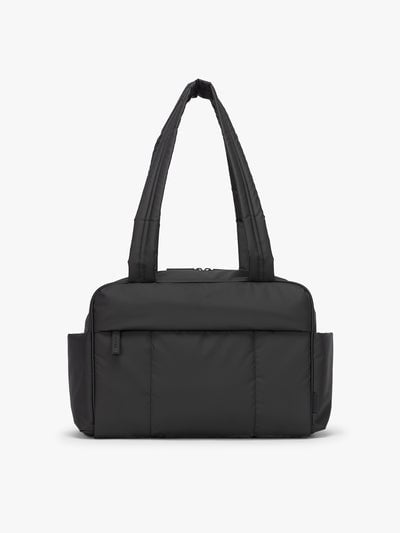 CALPAK Mini Duffel in black front view with puffy exterior, interior and exterior pockets, and padded shoulder straps; DLM2501-MATTE-BLACK