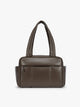 Dark brown Mushroom vegan leather CALPAK Luka Mini Duffel with dual top handles and side pockets, photographed against a clean white background; DLM2501-MUSHROOM-PU