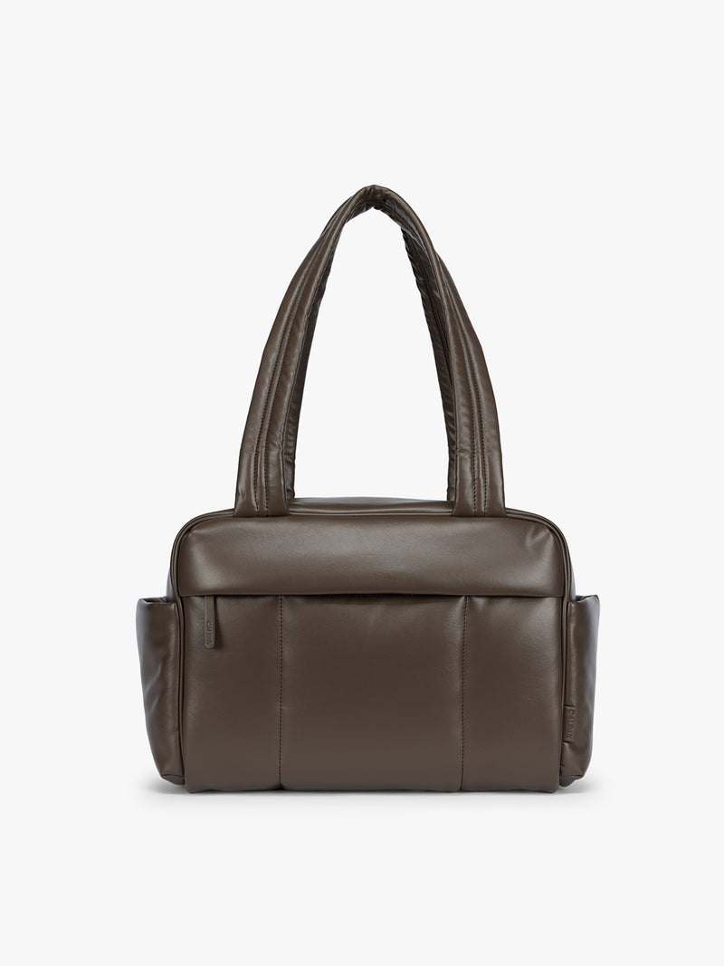 Dark brown Mushroom vegan leather CALPAK Luka Mini Duffel with dual top handles and side pockets, photographed against a clean white background
