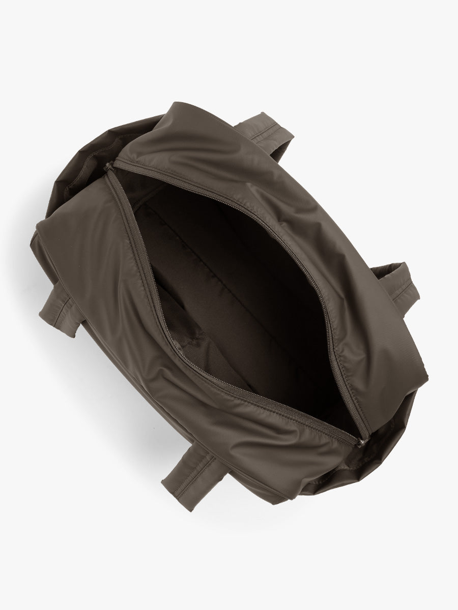 Opened CALPAK Luka Mini Duffel in brown Mushroom; DLM2501-MUSHROOM
