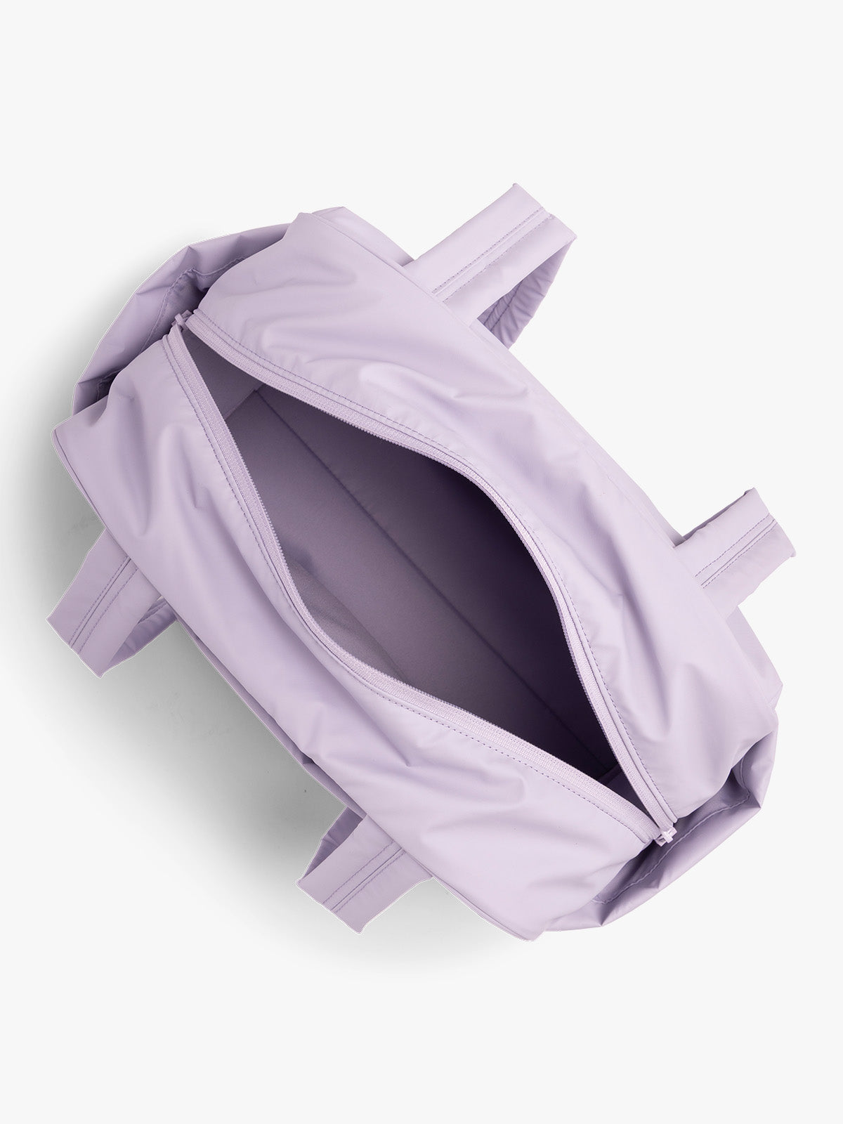 Opened interior of CALPAK Luka Mini Duffel in light purple Orchid on a white background; DLM2501-ORCHID