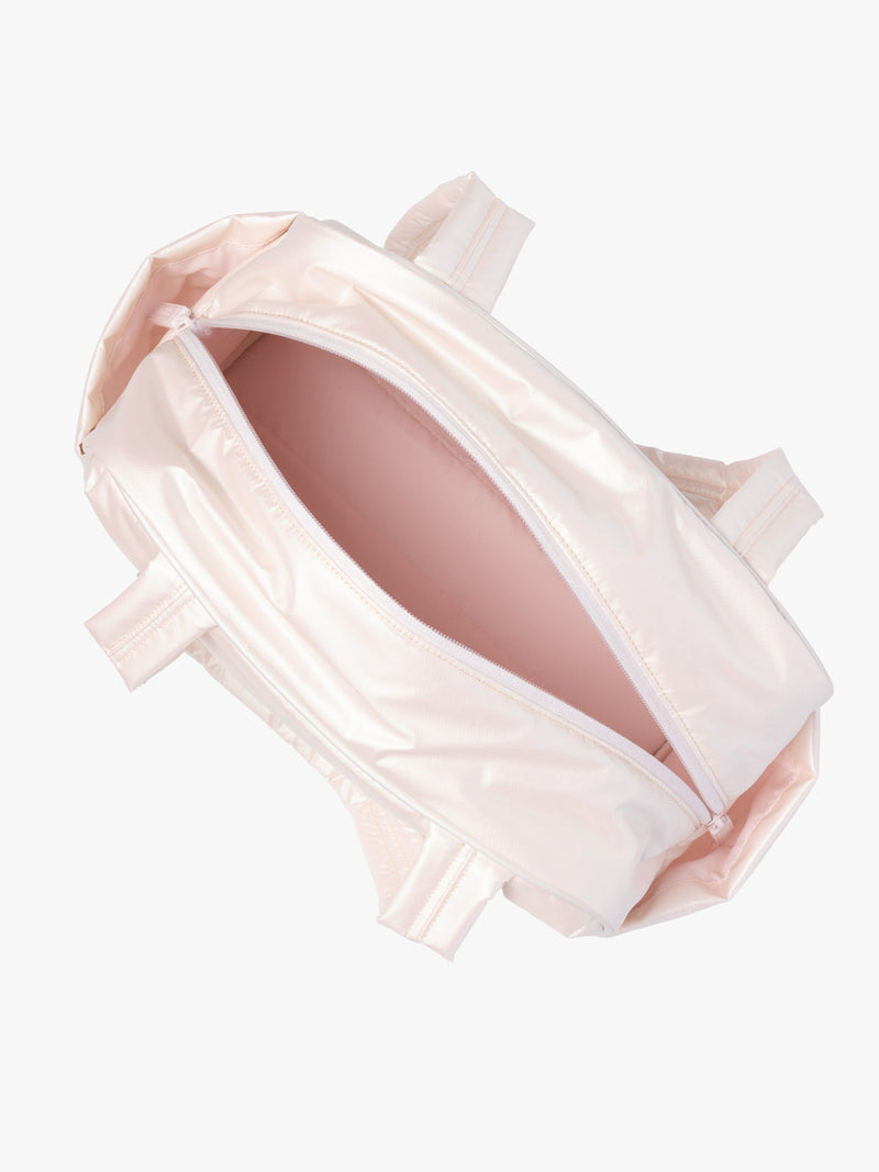 Opened CALPAK Luka Mini Duffel in light pink shiny Pearlescent