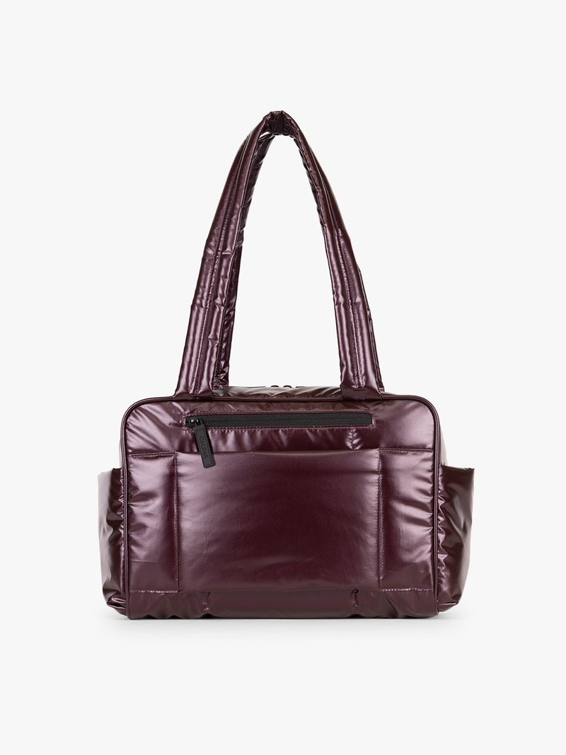 Back view of CALPAK Luka Mini Duffel in maroon Glazed Dark Cherry on a white background
