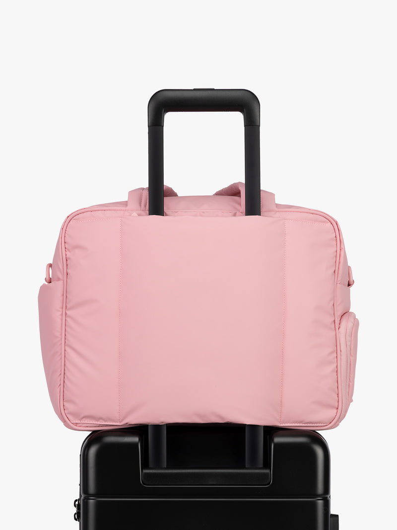 CALPAK Luka Duffel in monochrome pink Blossom trolley sleeve