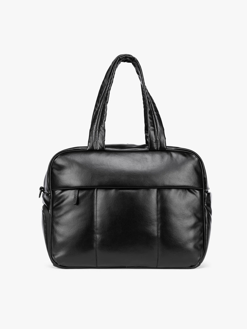 A Black CALPAK Luka Duffel in vegan leather with dual top handles and a front zippered pocket, photographed against a clean white background