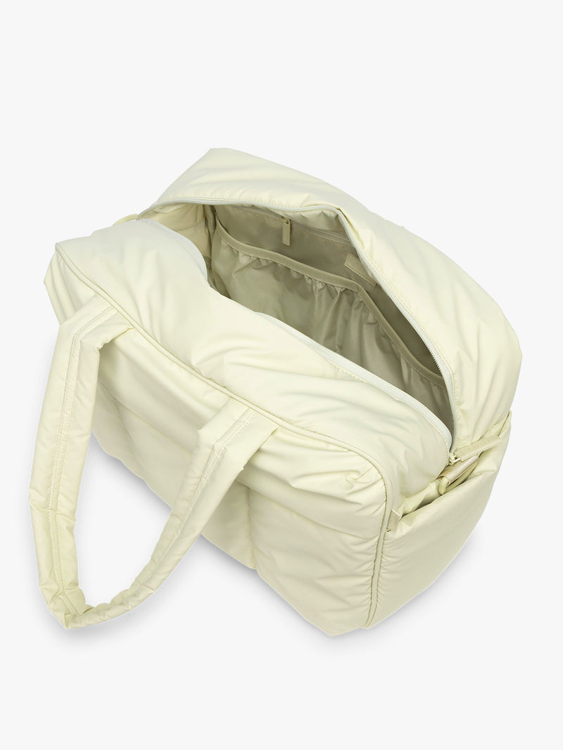 Opened CALPAK Luka Duffel in light green Celadon