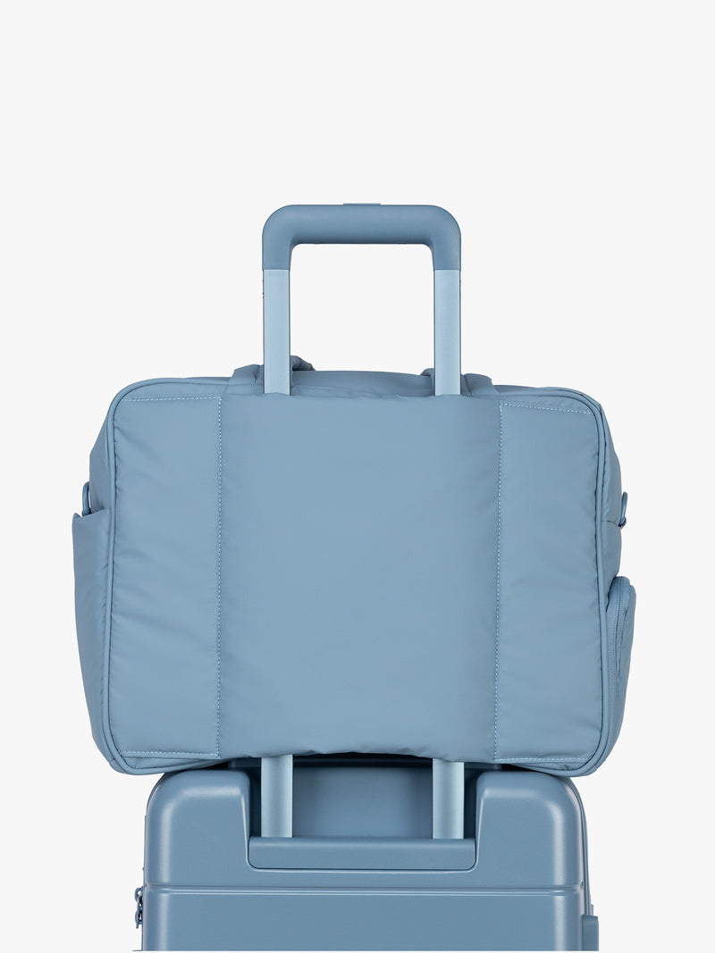 Luggage trolley sleeve of CALPAK Luka Duffel in light blue French Blue