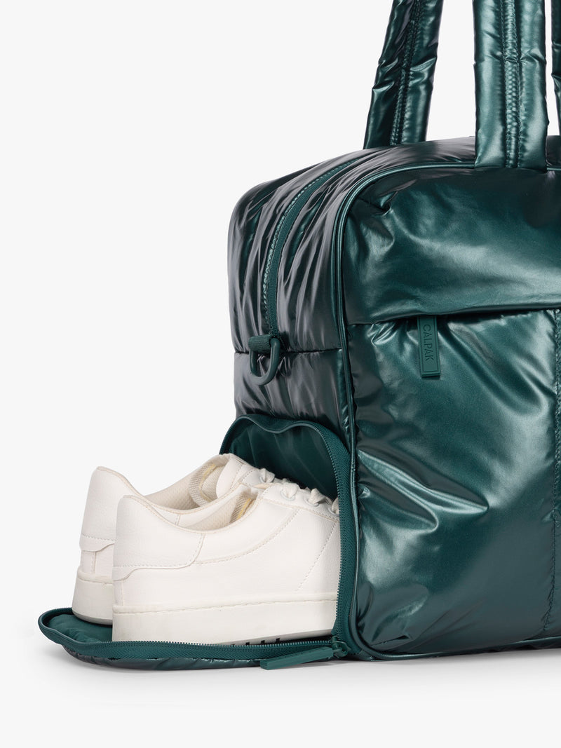 Shoe compartment of CALPAK  Luka Duffel in dark green shiny Glazed Kale
