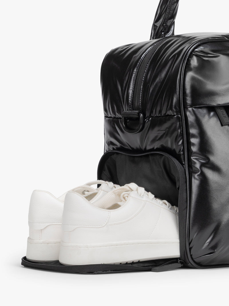Black duffel bag shoe compartment on a white background
