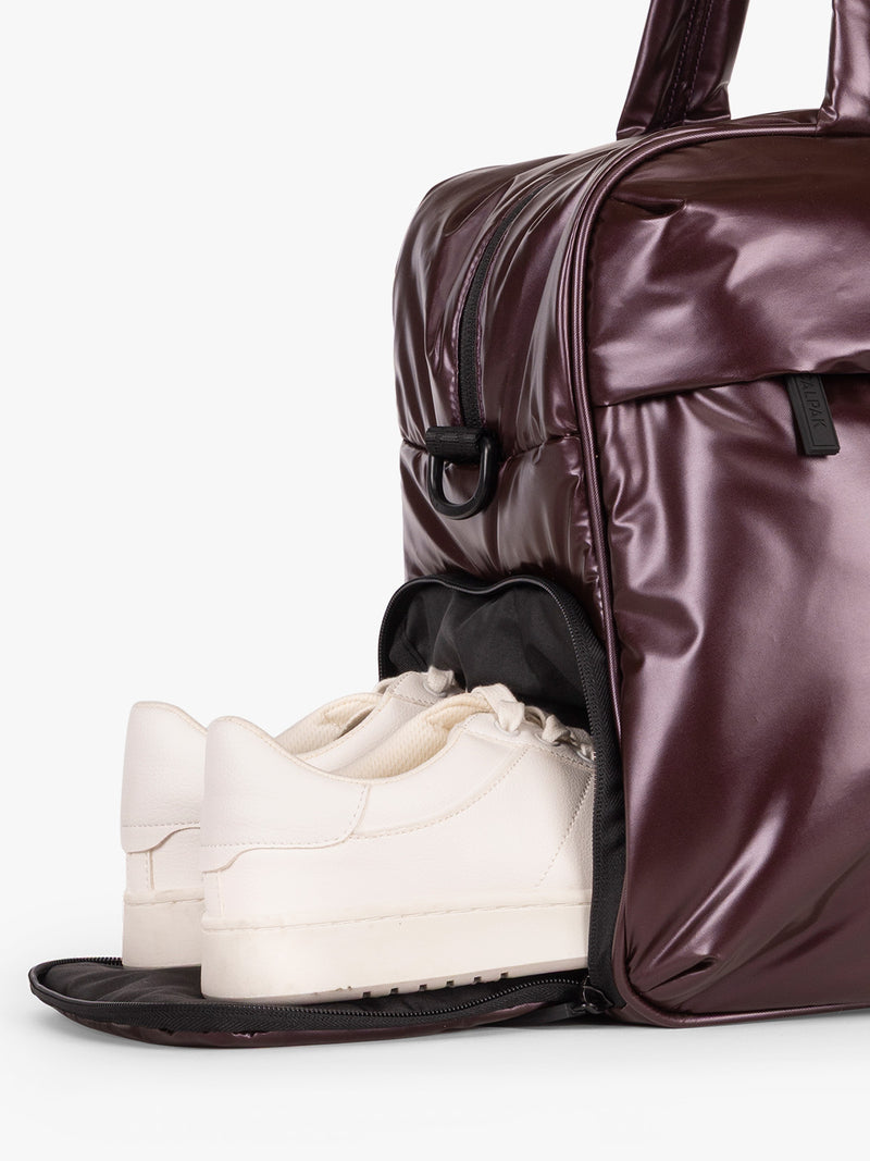 CALPAK Dark Cherry red Luka Duffel side shoe comparment on a white background