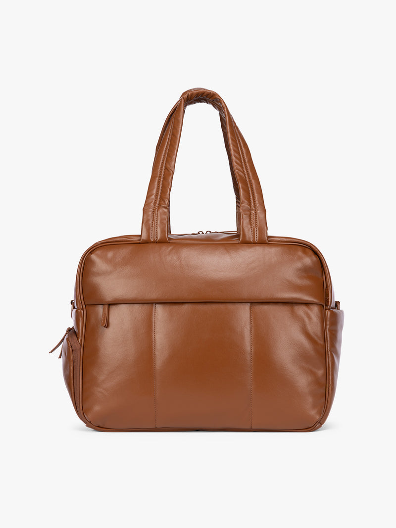 Honey Brown CALPAK Luka Duffel in vegan leather with dual top handles and a front zippered pocket, photographed against a clean white background