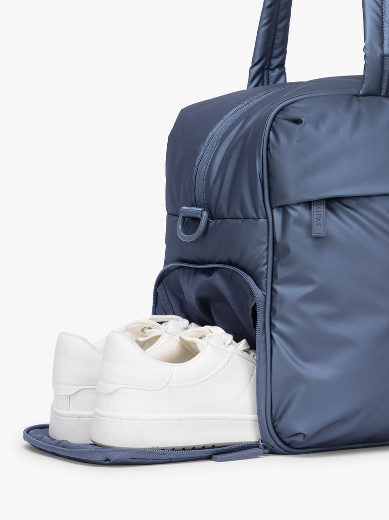 Shoe compartment of CALPAK Luka Duffel in metallic dark blue material Metallic Indigo