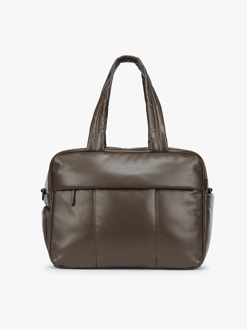 A dark brown Mushroom CALPAK Luka Duffel in vegan leather with dual top handles and a front zippered pocket, photographed against a clean white background