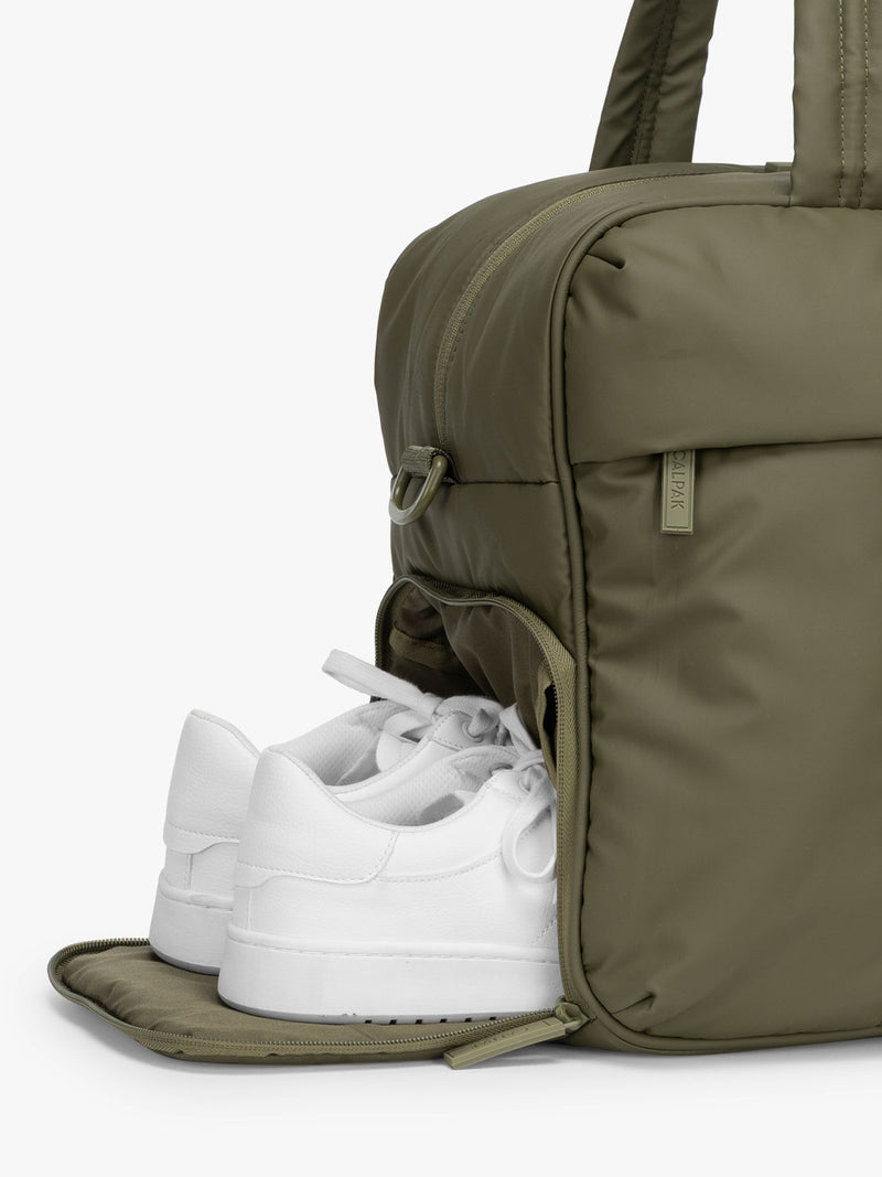 CALPAK Luka Duffel in dark green Pine shoe compartment