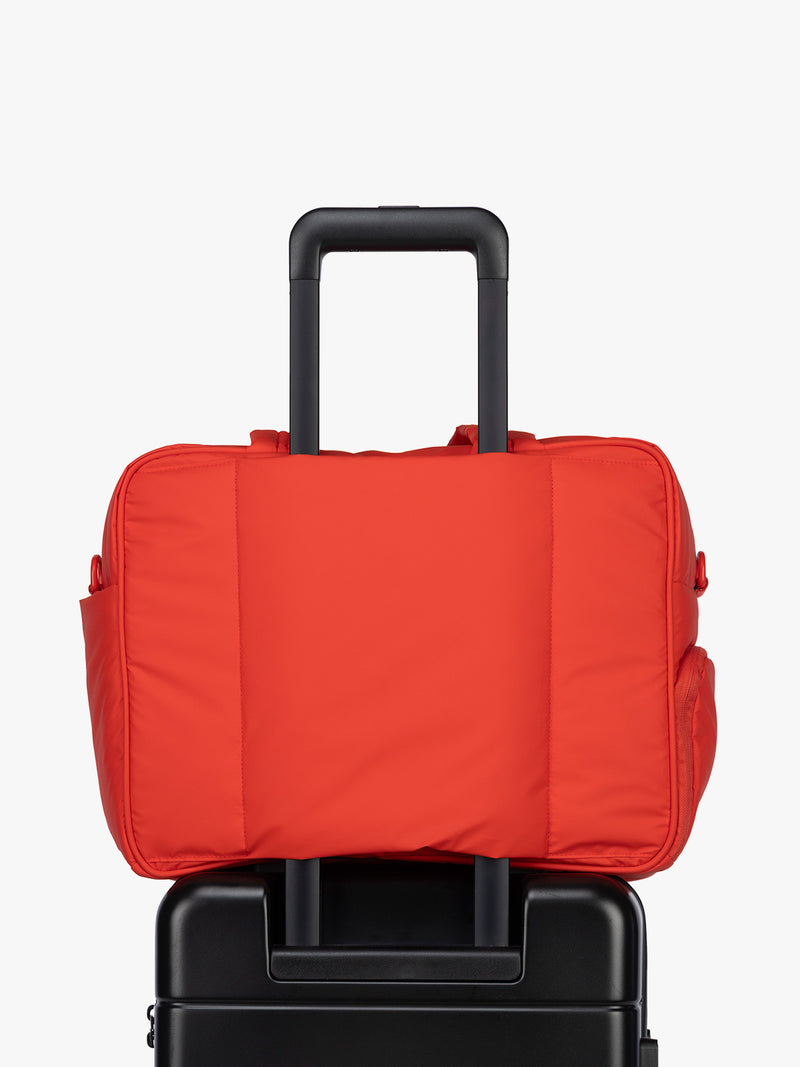 Luggage trolley sleeve of CALPAK Luka Duffel in red Tomato