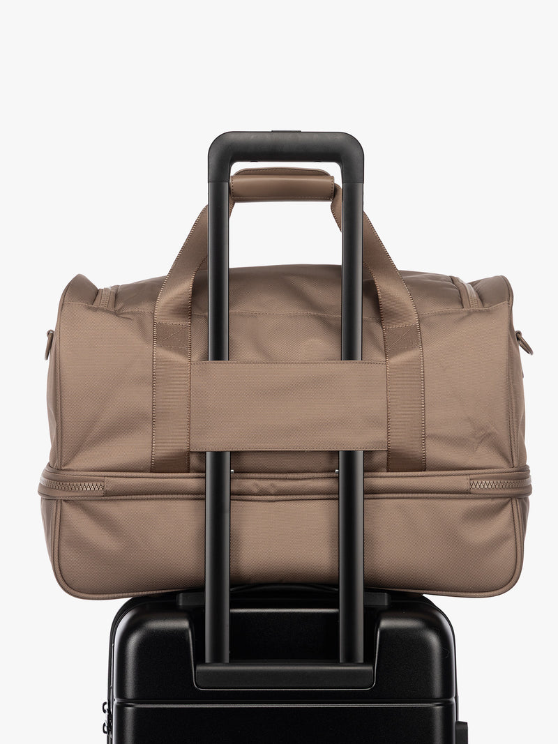 Luggage trolley sleeve of CALPAK Stevyn Duffel with Shoe Compartment in brown Chocolate