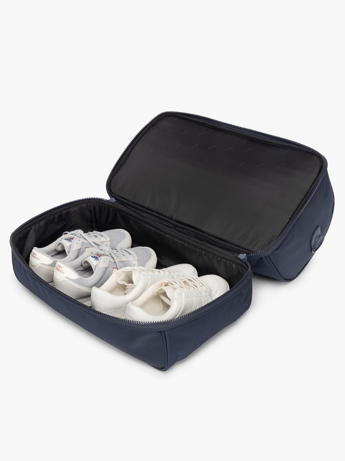 Shoe compartment of CALPAK Stevyn Duffel with Shoe Compartment in dark blue Navy; DST7019-NAVY