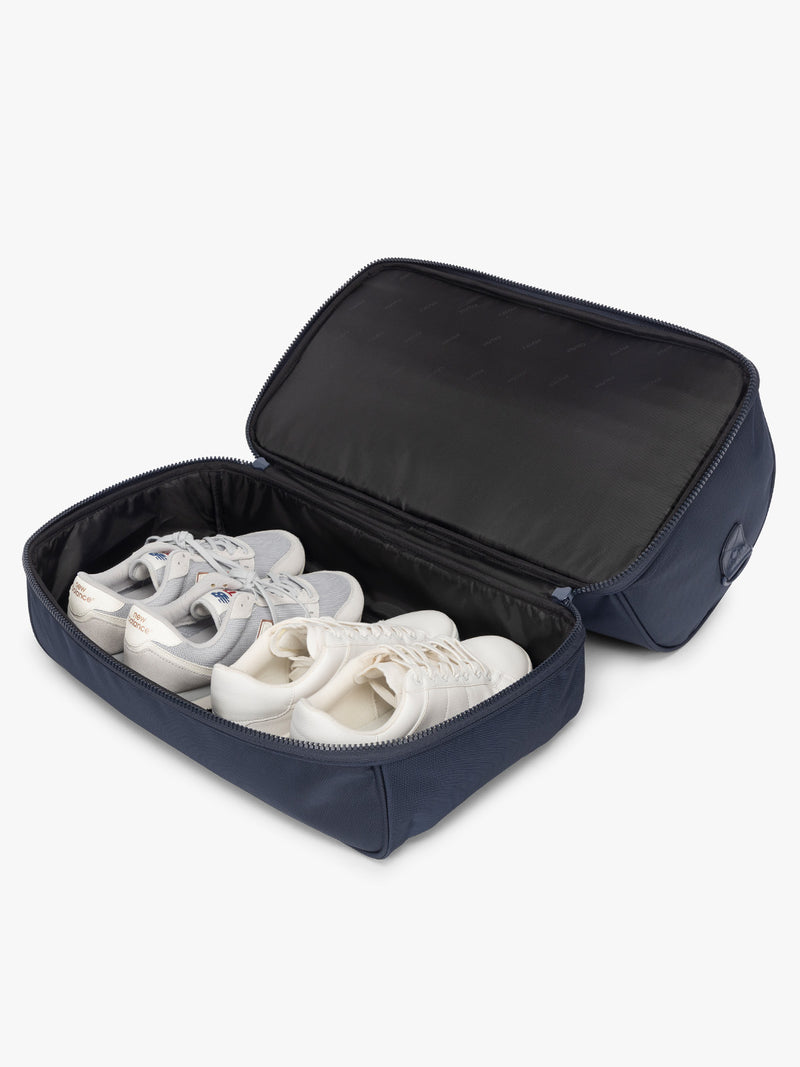 Shoe compartment of CALPAK Stevyn Duffel with Shoe Compartment in dark blue Navy
