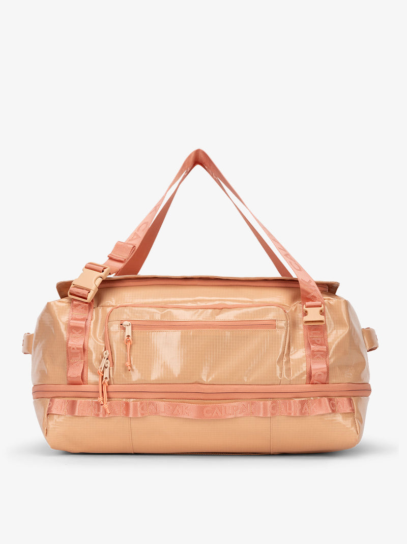 CALPAK Terra 50L Duffel Backpack in salmon color Canyon