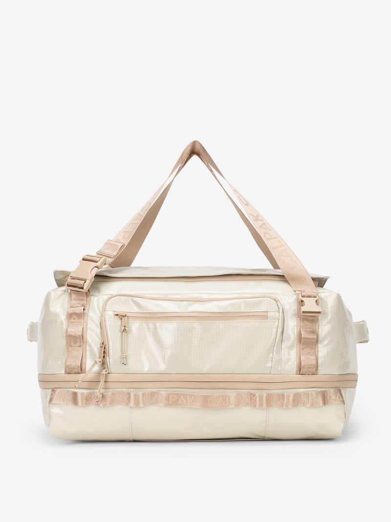 CALPAK Terra 50L Duffel Backpack in off-white beige White Sands