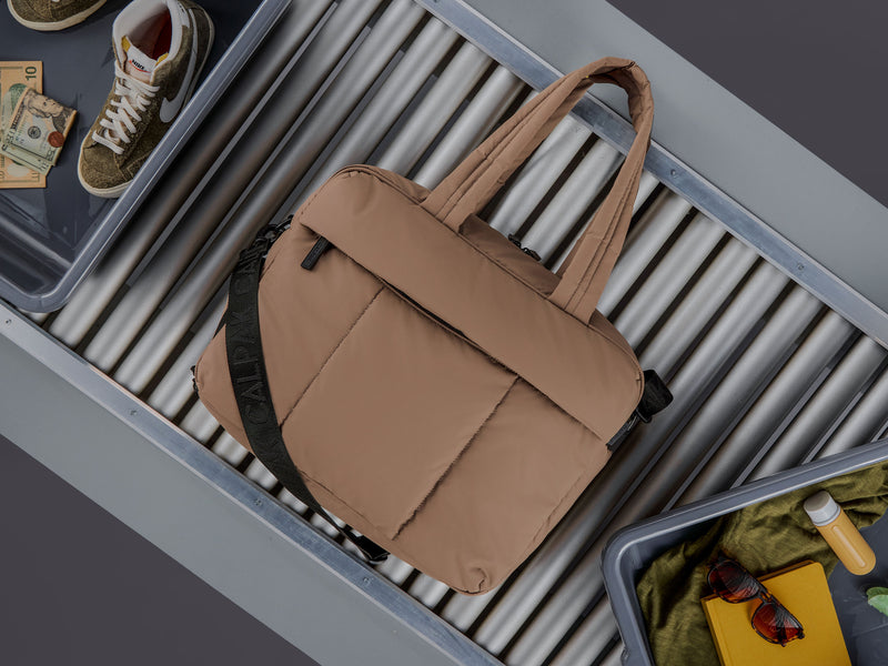 CALPAK Luka Duffel brown Chocolate color at the airport