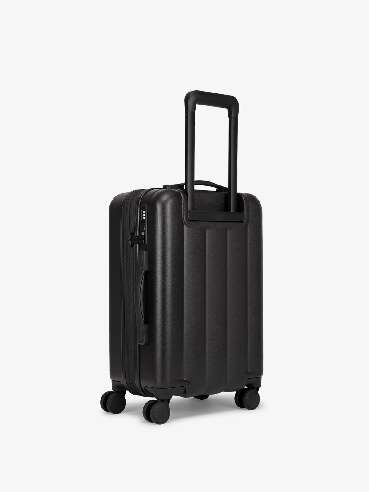Black CALPAK carry-on luggage featuring dual spinner wheels and bottom grab handle