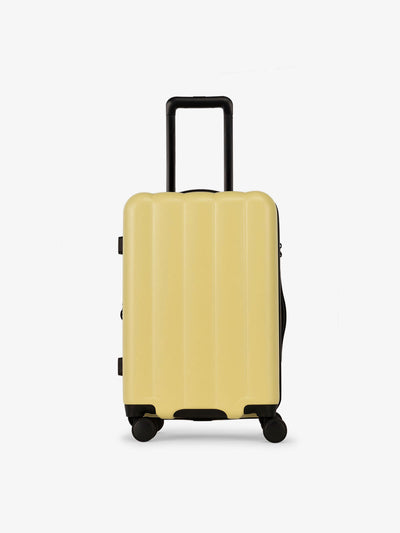 CALPAK Pacific blue carry-on luggage made from an ultra-durable polycarbonate shell and expandable by up to 2 in butter; LCO1020-BUTTER view 1