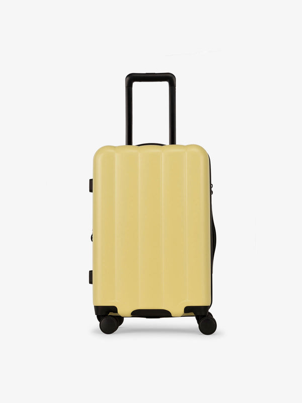 CALPAK Pacific blue carry-on luggage made from an ultra-durable polycarbonate shell and expandable by up to 2" in butter