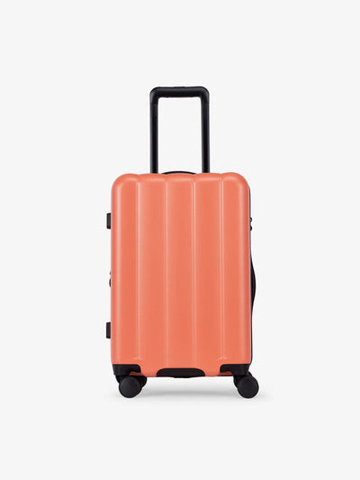 CALPAK Pacific blue carry-on luggage made from an ultra-durable polycarbonate shell and expandable by up to 2 in persimmon; LCO1020-PERSIMMON view 1