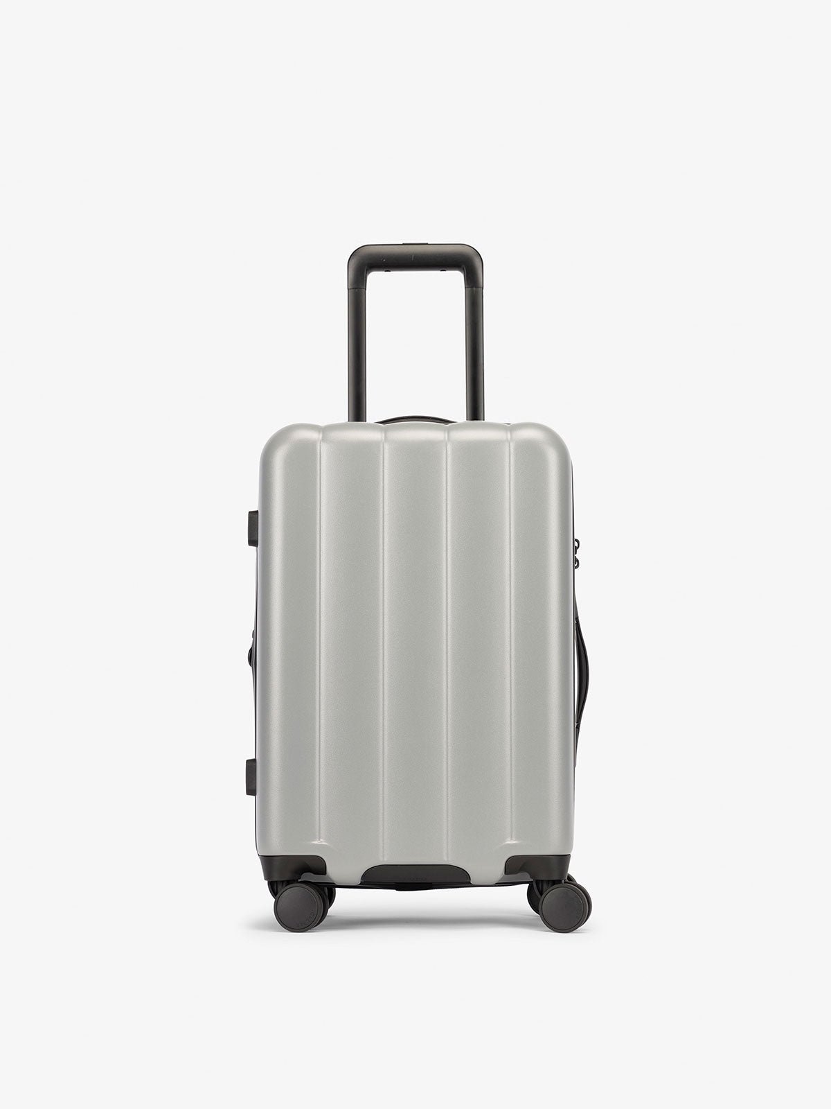 Smoke gray carry-on luggage made from an ultra-durable polycarbonate shell and expandable by up to 2"
