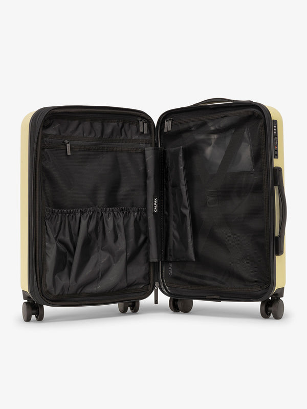 Yellow butter CALPAK Evry Carry-On Luggage features divided compartments with interior pockets for organized packing