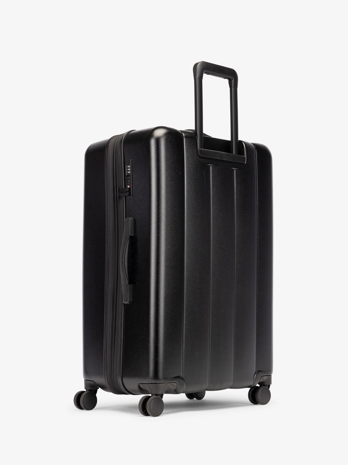 CALPAK large luggage featuring dual spinner wheels and bottom grab handle in black
