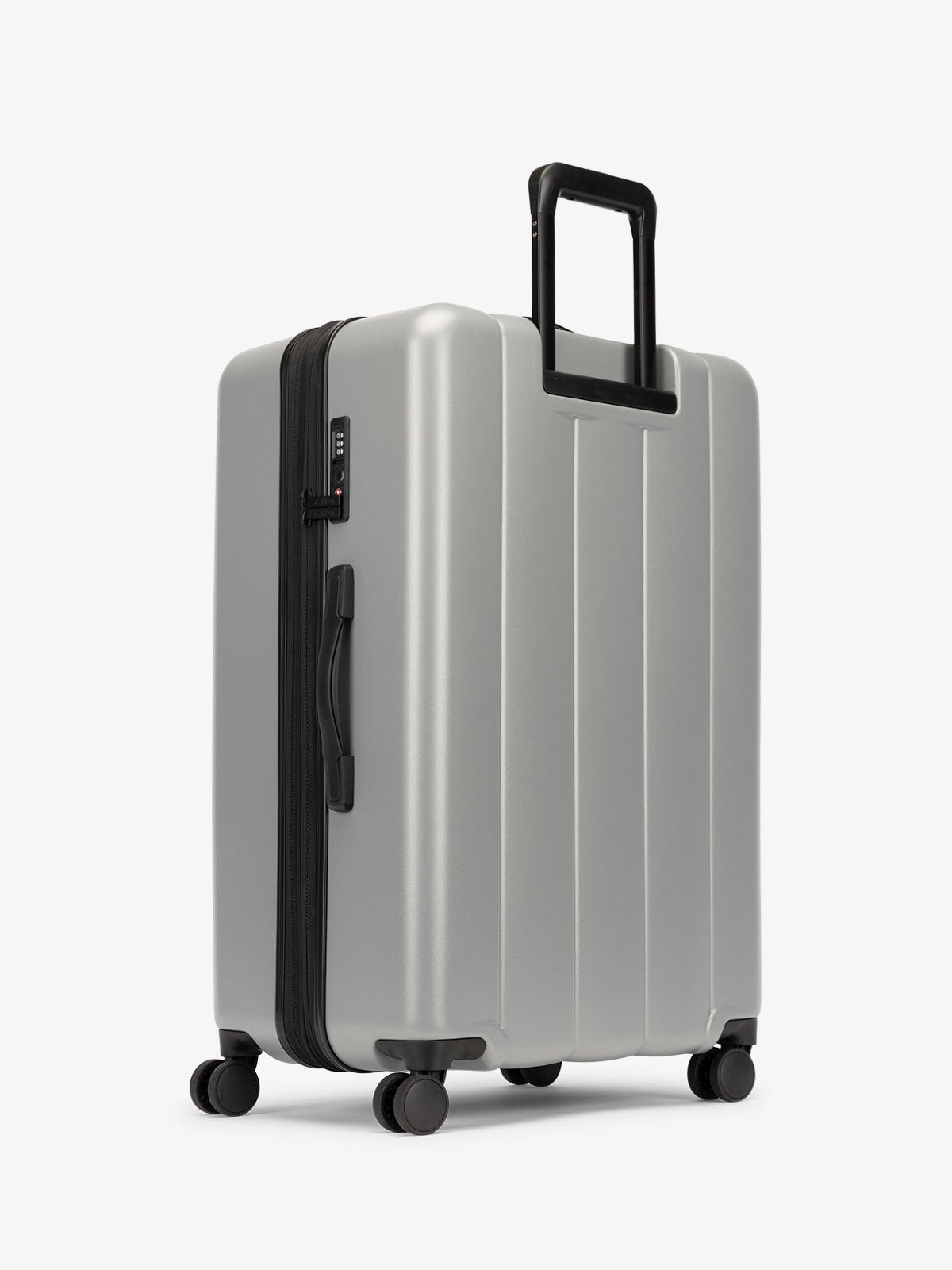 CALPAK large luggage featuring dual spinner wheels and bottom grab handle in gray