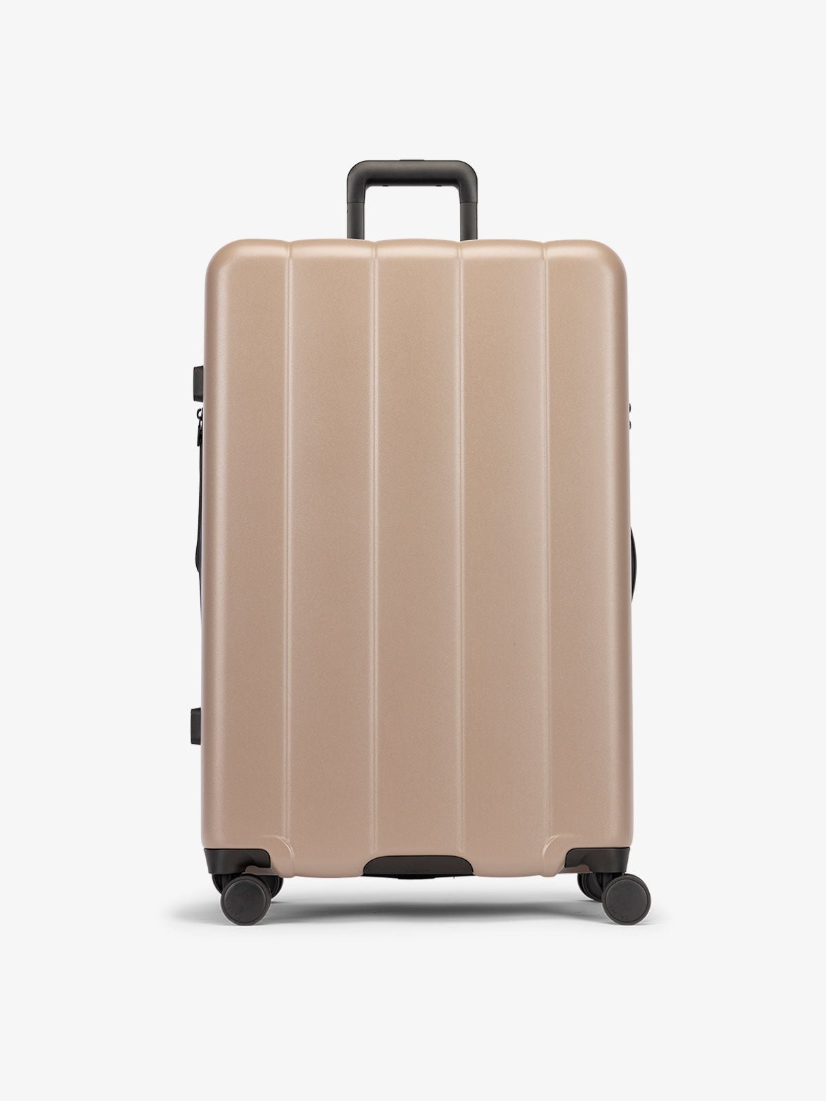 Brown chocolate large luggage made from an ultra-durable polycarbonate shell and expandable by up to 2"