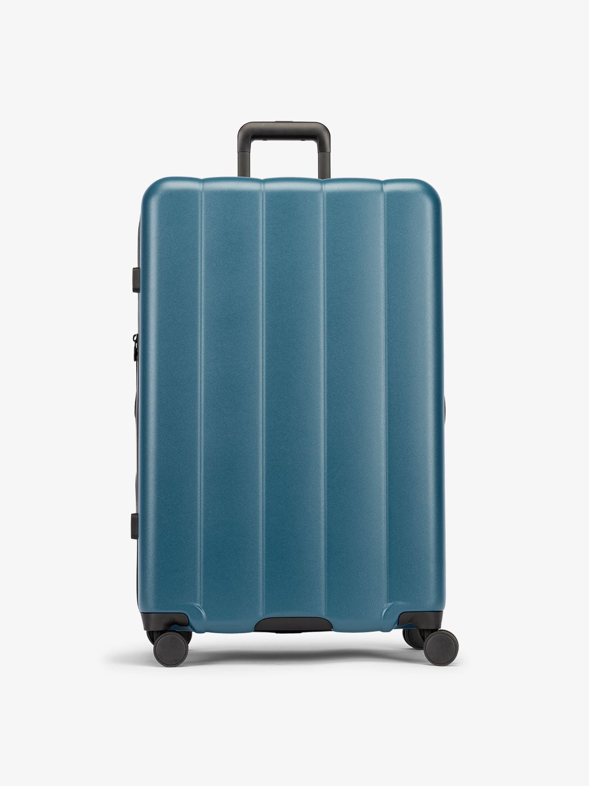 Pacific blue large luggage made from an ultra-durable polycarbonate shell and expandable by up to 2"