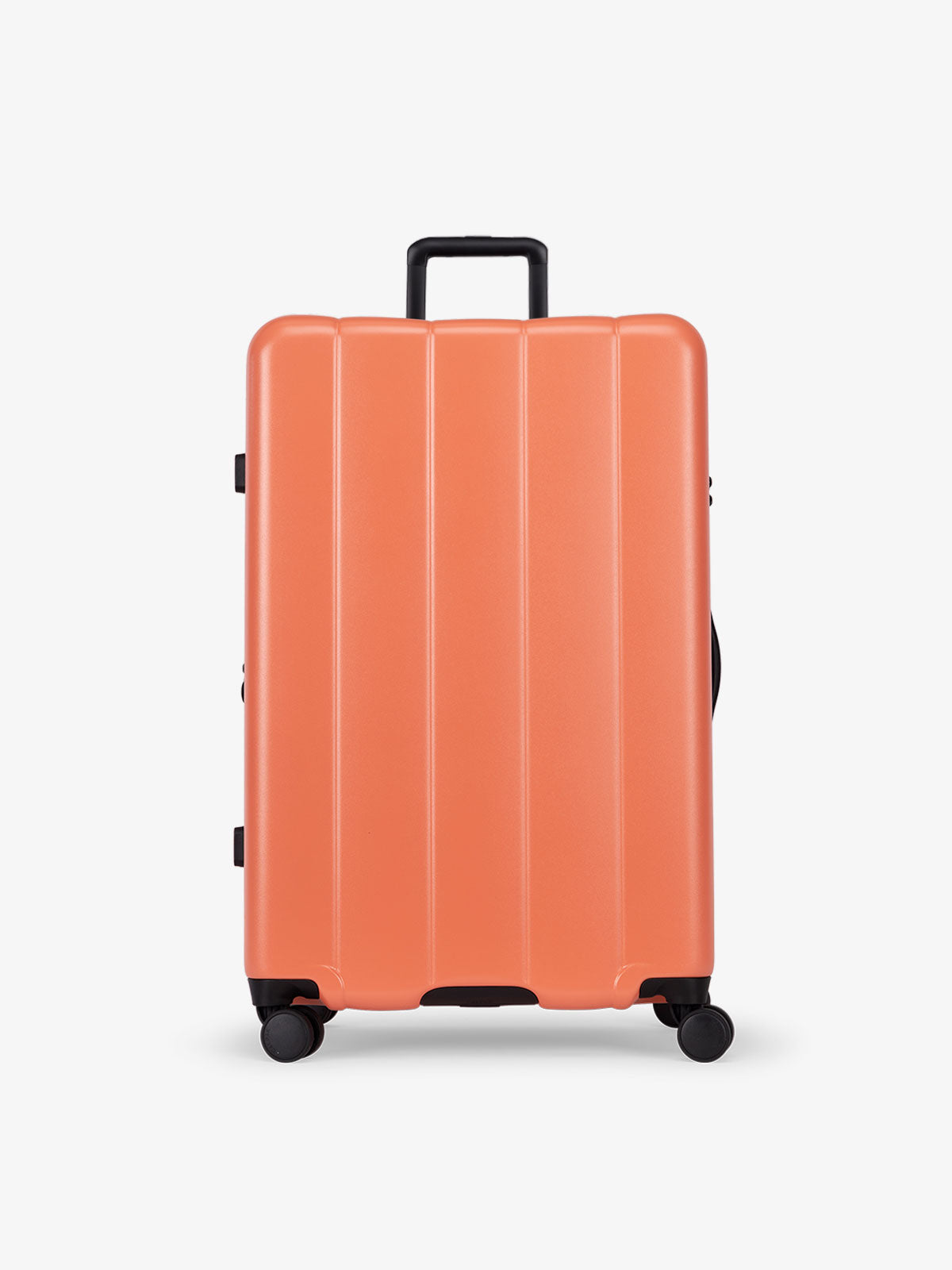 CALPAK persimmon orange large luggage made from an ultra-durable polycarbonate shell and expandable by up to 2"; LCO1028-PERSIMMON
