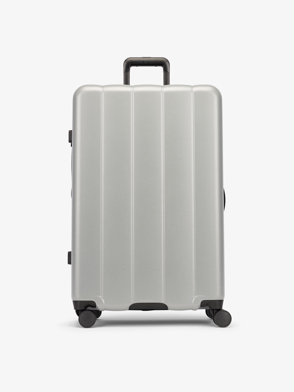 Gray smoke large luggage made from an ultra-durable polycarbonate shell and expandable by up to 2"