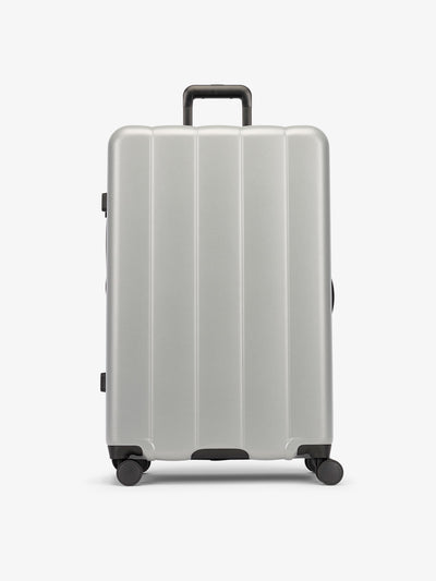 Gray smoke large luggage made from an ultra-durable polycarbonate shell and expandable by up to 2