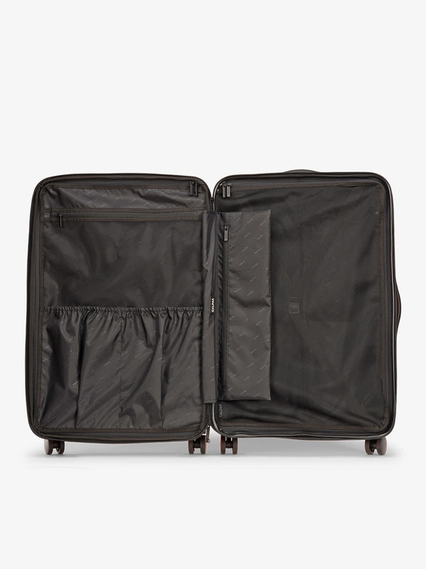 Butter CALPAK Evry Large Luggage features divided compartments with interior pockets for organized packing