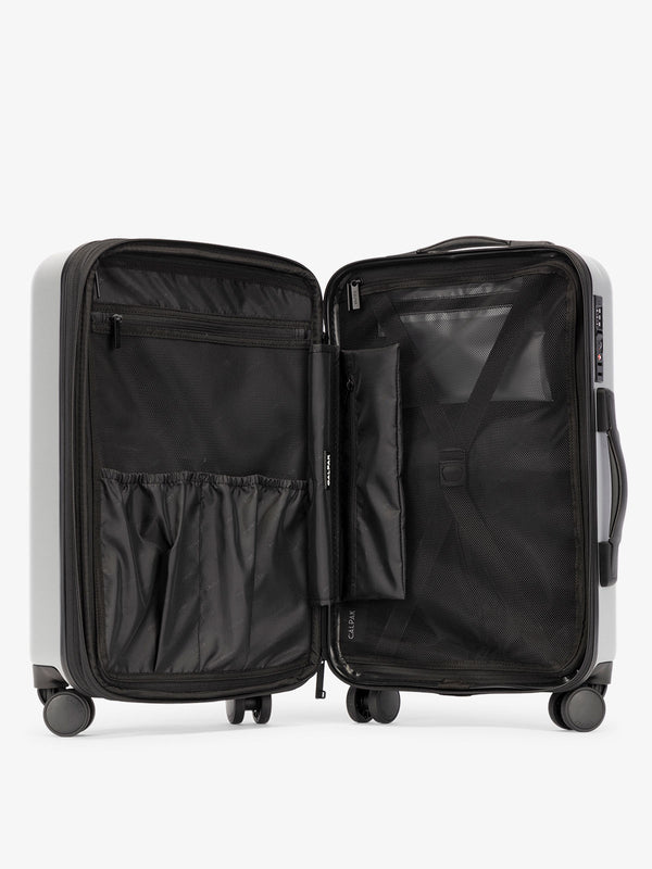 Smoke gray CALPAK Evry Large Luggage features divided compartments with interior pockets for organized packing