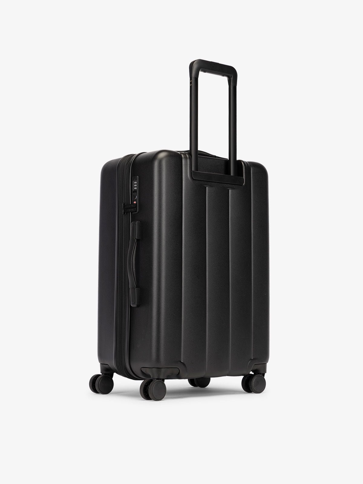 CALPAK medium luggage featuring dual spinner wheels and bottom grab handle in black