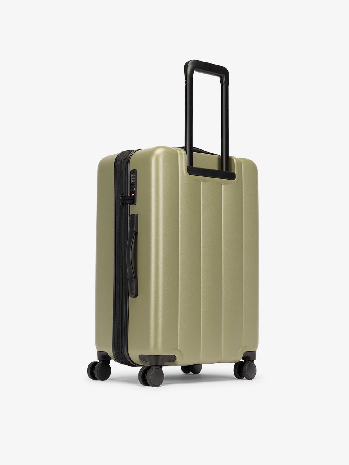 CALPAK medium luggage featuring dual spinner wheels and bottom grab handle in pistachio